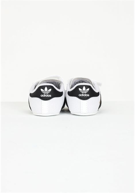 White Superstar baby sneakers with iconic contrasting details ADIDAS ORIGINALS | S79916.